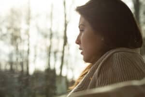 Woman sitting on her porch.