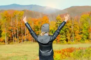 woman throwing her hands up Overcoming Fatigue in Treatment