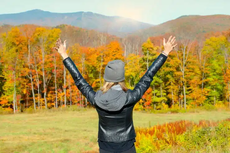 woman throwing her hands up Overcoming Fatigue in Treatment